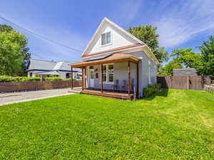 View of front of house with covered porch and brick siding
