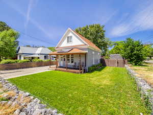 View of front of home featuring brick siding and a porch