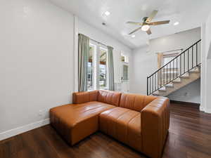 Living area with recessed lighting, stairway, dark wood-style floors, and ceiling fan