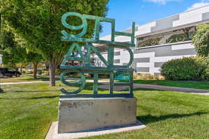 View of home's community with a yard