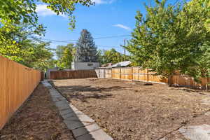 View of fenced backyard
