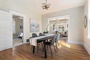 Dining area featuring light wood-type flooring and a ceiling fan
