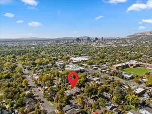 Aerial view of property's location with a mountain backdrop and nearby suburban area