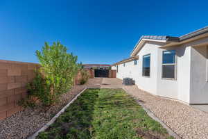 View of fenced backyard