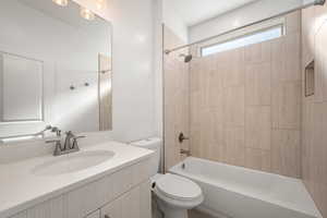 Full bathroom with shower / tub combination and vanity