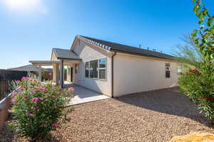 Rear view of property with a patio