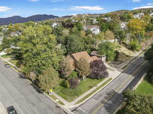 Aerial perspective of suburban area with a mountain backdrop
