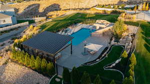 Aerial view of a pool area and a mountainous background