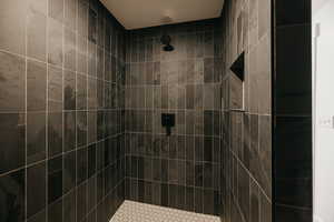 Bathroom featuring contemporary tiled shower