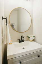 1/2 Bathroom featuring vanity off of mudroom