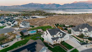 Aerial perspective of suburban area with a water and mountain view