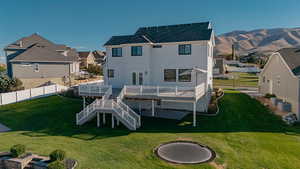 Back of house with stairs, a massive deck with amazing views!
