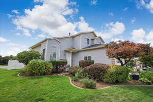 View of front of property with a front yard