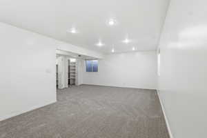 Unfurnished room with carpet floors and recessed lighting