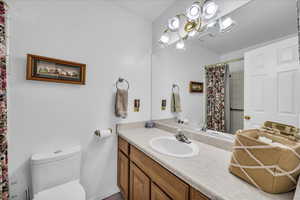 Bathroom with vanity and curtained shower