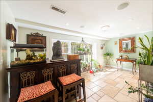 Sitting room featuring stone tile flooring and recessed lighting