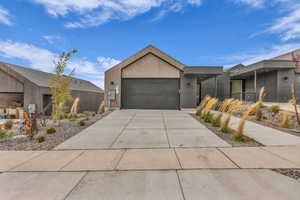Contemporary house featuring driveway and an attached garage