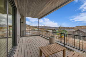 Deck featuring a mountain view and a residential view