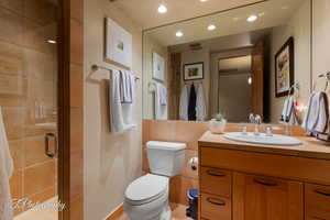Full bath with vanity, a stall shower, and recessed lighting