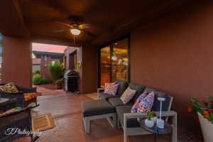 View of patio with ceiling fan, a grill, and outdoor lounge area