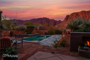 View of pool featuring a patio area and a mountain view