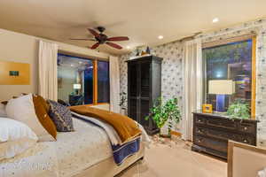 Bedroom featuring access to outside, recessed lighting, ceiling fan, and wallpapered walls