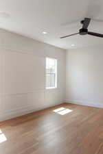 Spare room featuring light wood-style flooring, recessed lighting, and a ceiling fan