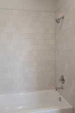 Full bathroom with tub / shower combination