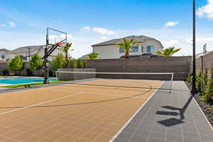 View of sport court featuring community basketball court and a tennis court