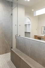 Full bathroom featuring walk in shower and a walk in closet