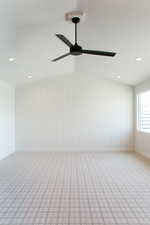 Spare room featuring recessed lighting, wood walls, light colored carpet, and ceiling fan