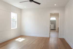 Spare room featuring light wood-type flooring, healthy amount of natural light, ceiling fan, and recessed lighting