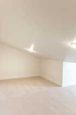 Spare room featuring light carpet