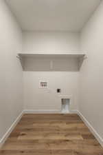 Laundry room featuring light wood finished floors, washer hookup, and electric dryer hookup