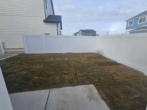 View of fenced backyard