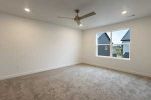 Empty room with light carpet, recessed lighting, and a ceiling fan