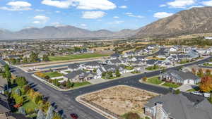 Aerial view of residential area featuring a mountainous background