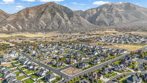 View of mountain backdrop featuring nearby suburban area