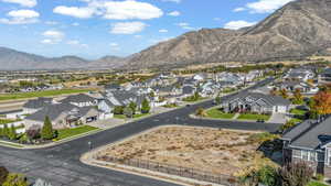 Aerial perspective of suburban area with a mountainous background