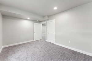 Below grade area with carpet floors and recessed lighting