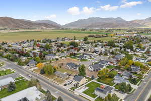 View of property location with nearby suburban area and mountains