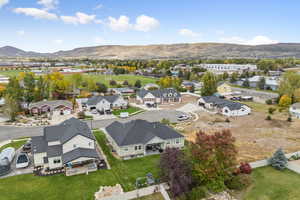 Aerial perspective of suburban area featuring a mountain backdrop
