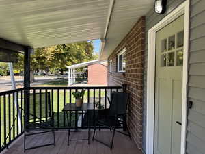 Wooden terrace with a yard