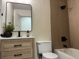 Bathroom with shower / tub combination and vanity