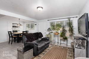 Living area with light wood finished floors and baseboards