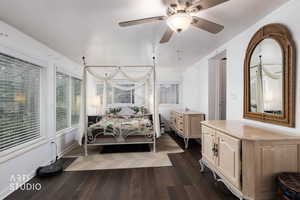 Bedroom with dark wood-type flooring and ceiling fan
