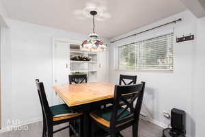 Dining area featuring wood finished floors and baseboards