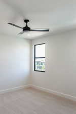 Empty room with light colored carpet, a ceiling fan, and recessed lighting