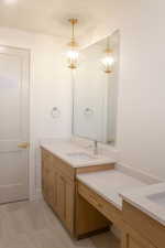 Full bathroom with vanity and light tile patterned flooring