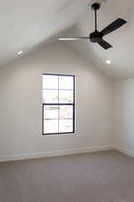 Empty room featuring light carpet, lofted ceiling, recessed lighting, and ceiling fan